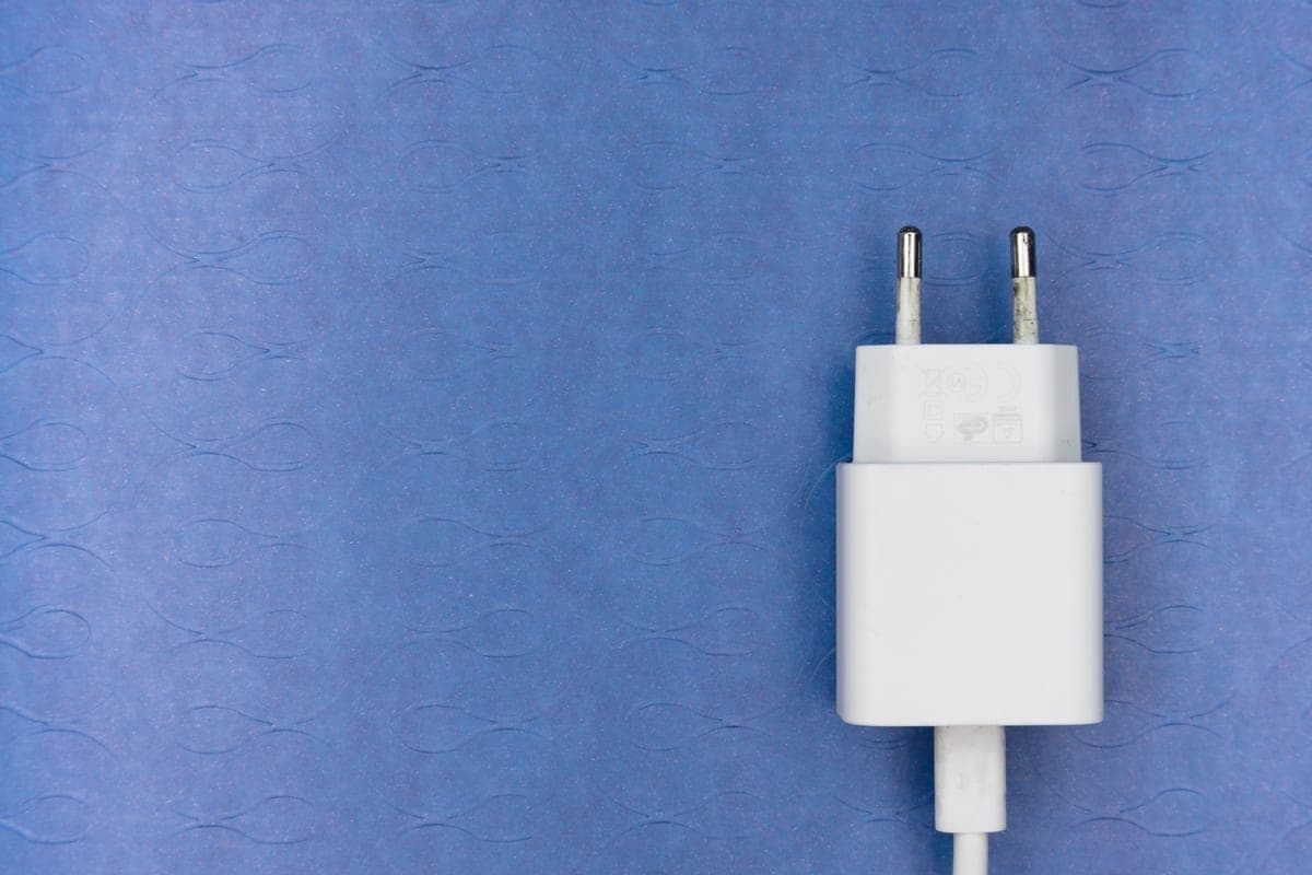Two power adapters photographed side by side on a plain surface