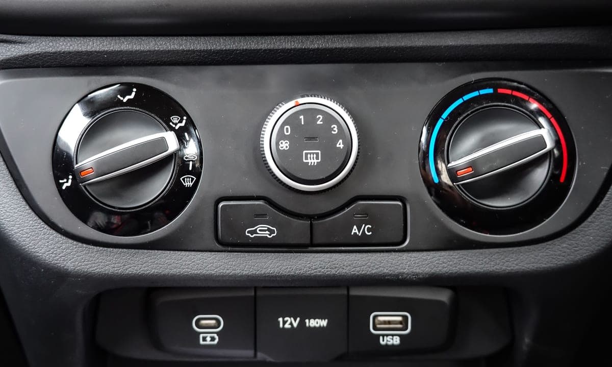 A 12V accessory socket in a car's center console