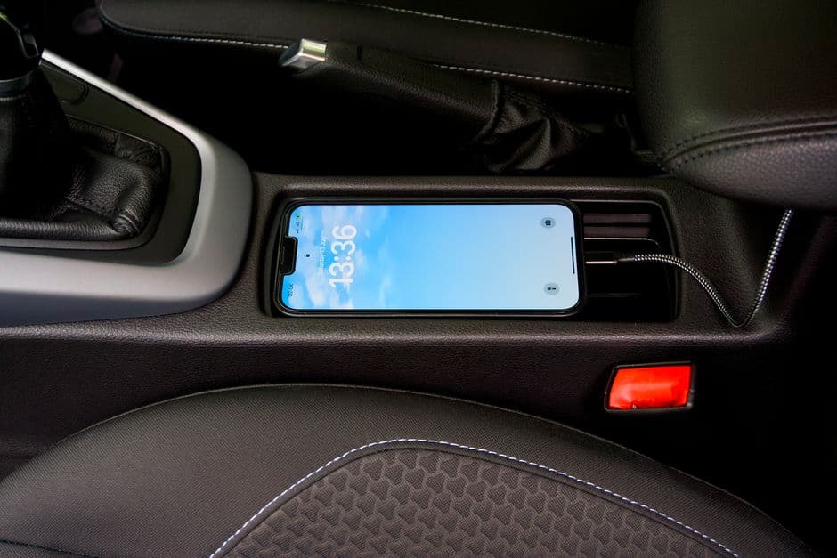 A 12V accessory socket in a car center console