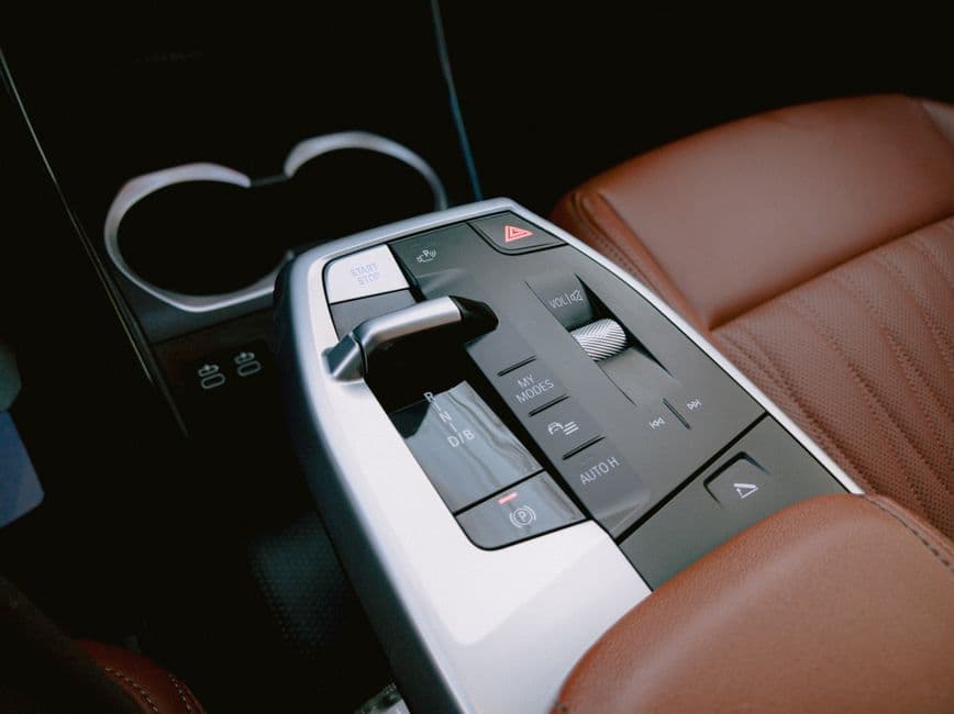 A car's center console armrest between the front seats