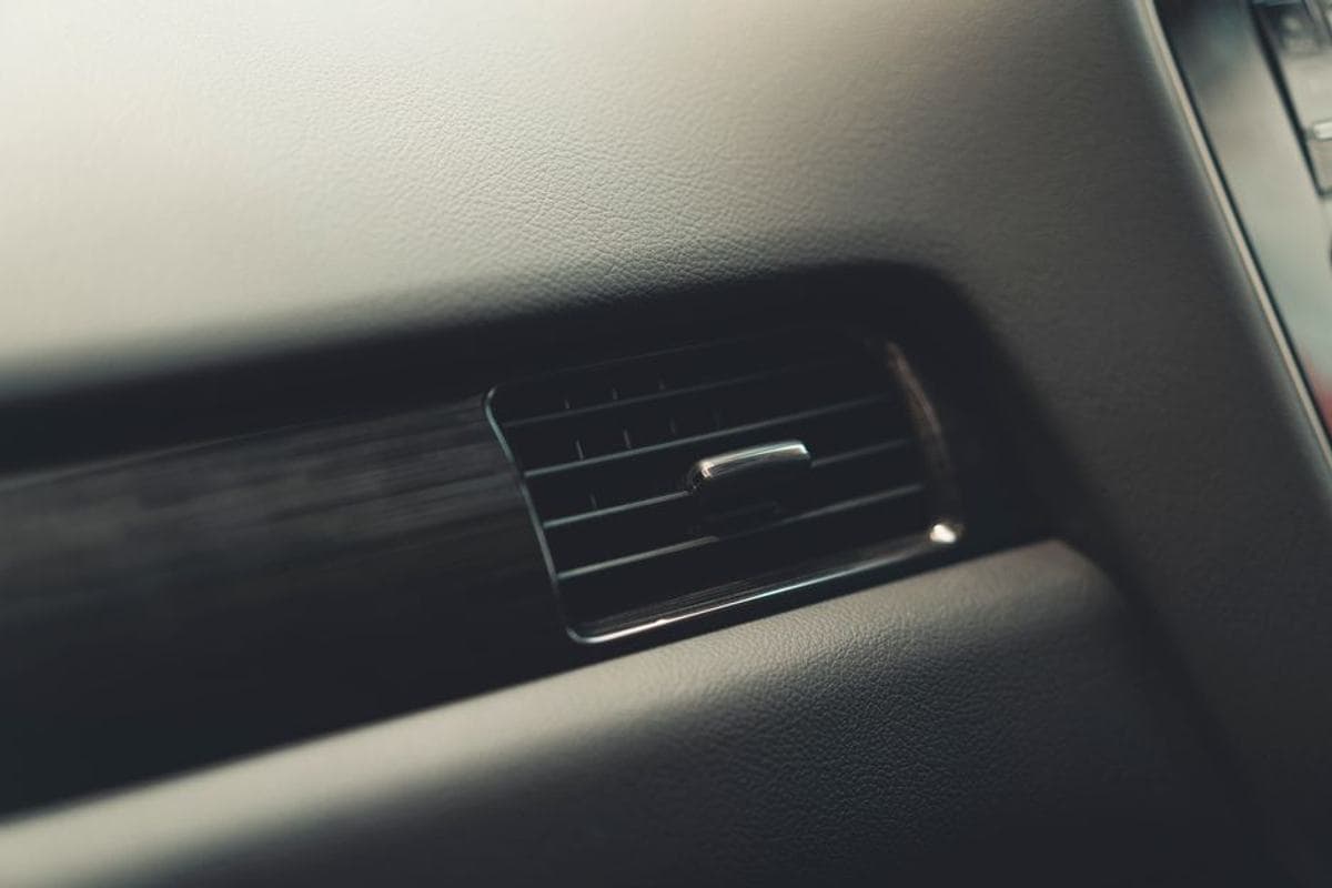 A close view of a car's dashboard air vents