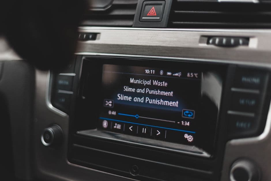 A double-DIN touchscreen stereo fitted in a car dashboard