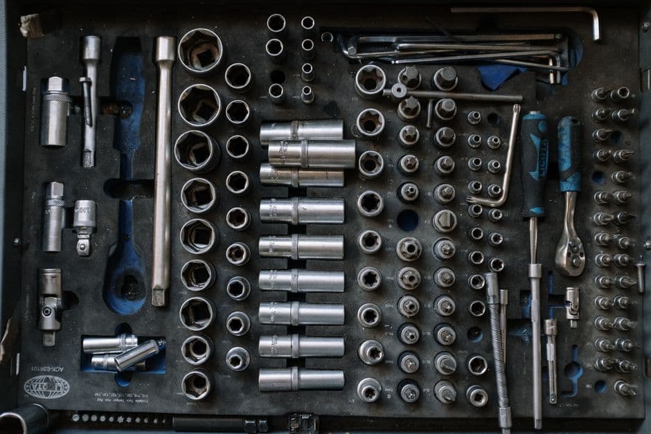 An organized set of mechanics sockets and wrenches in a case