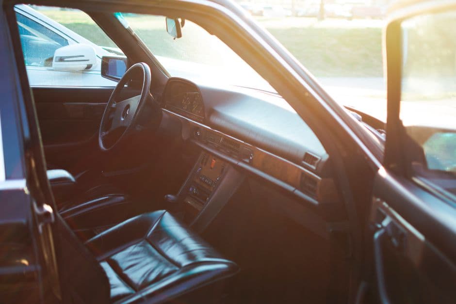 A car seat photographed from above in bright sunlight