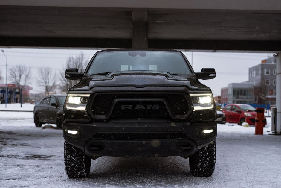 A pickup truck parked with the cab visible from the front
