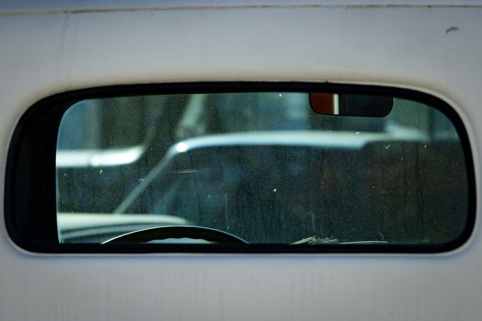 A car interior viewed from the rear seats toward the windshield
