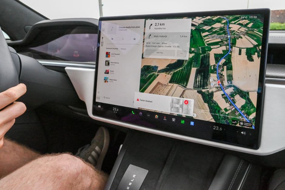 A portable touchscreen mounted on a car dashboard