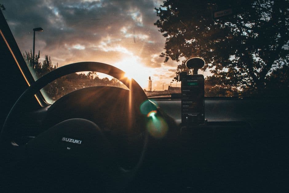 A radar detector mounted on a car windshield