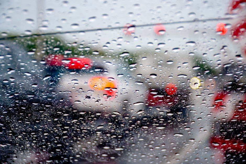 Rain beading on a car windshield