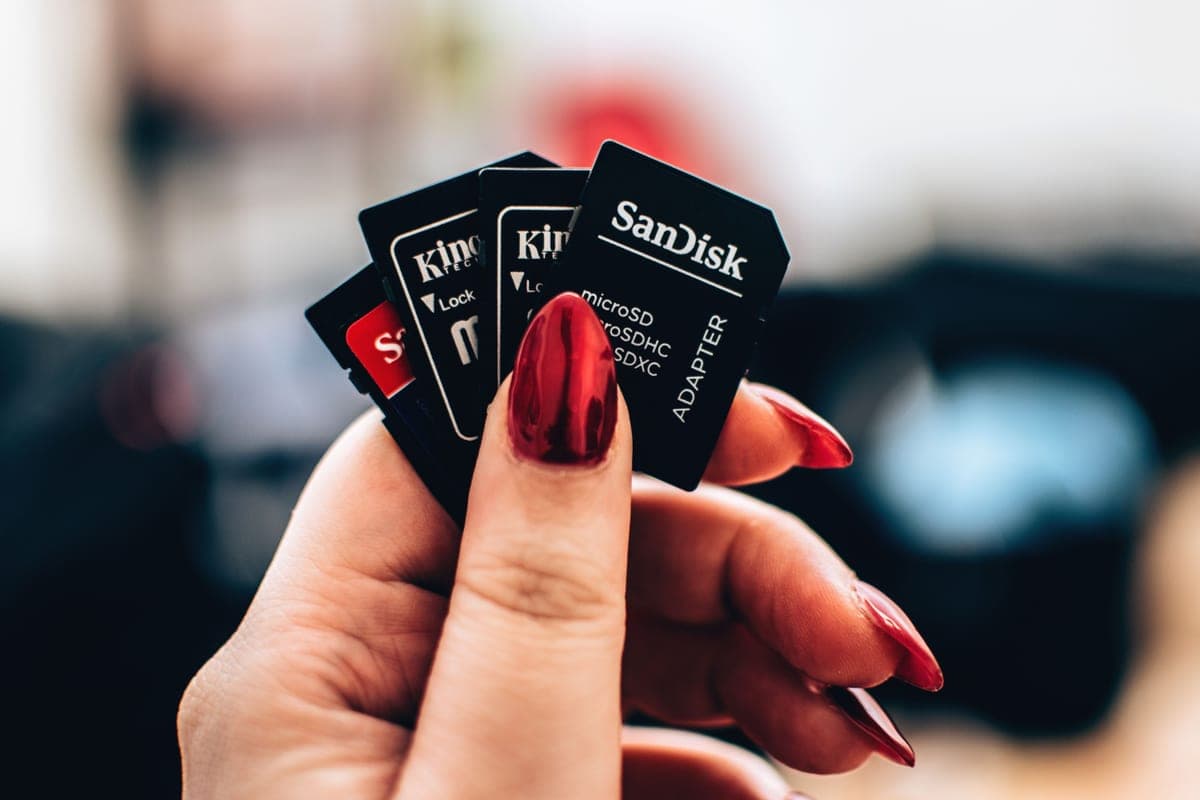 A microSD memory card photographed close up on a plain surface