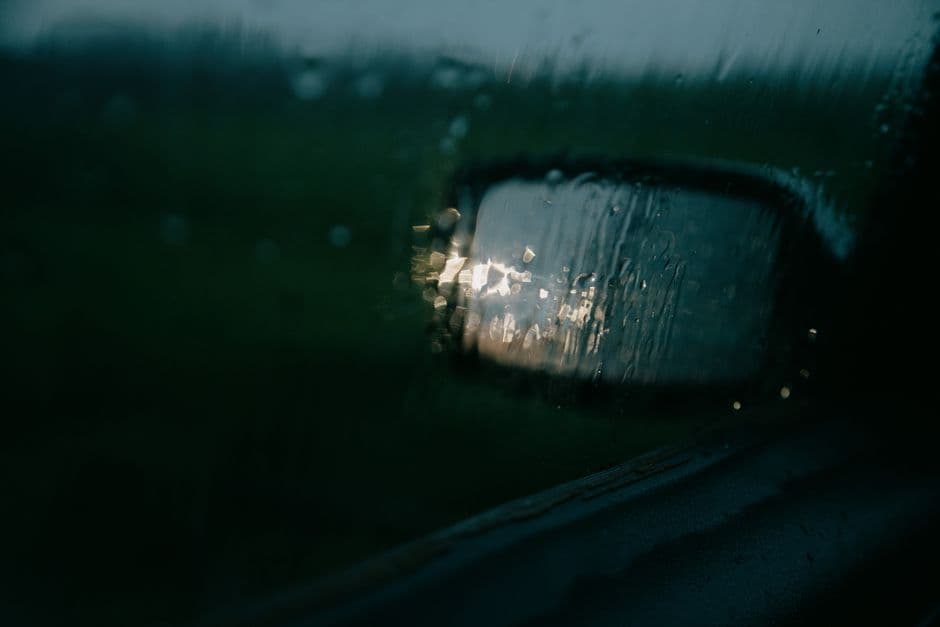 Sunlight falling through a car's rear side window onto the back seat