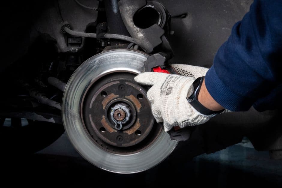 A torque wrench being used on a wheel nut