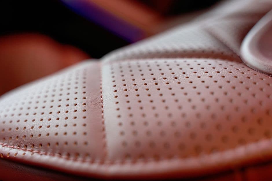 The fabric surface of a car seat photographed closely