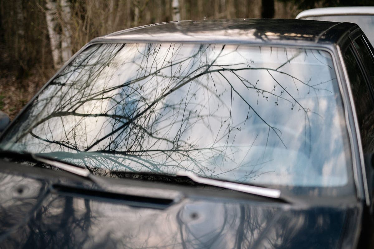Bright sunlight reflecting off a car windshield