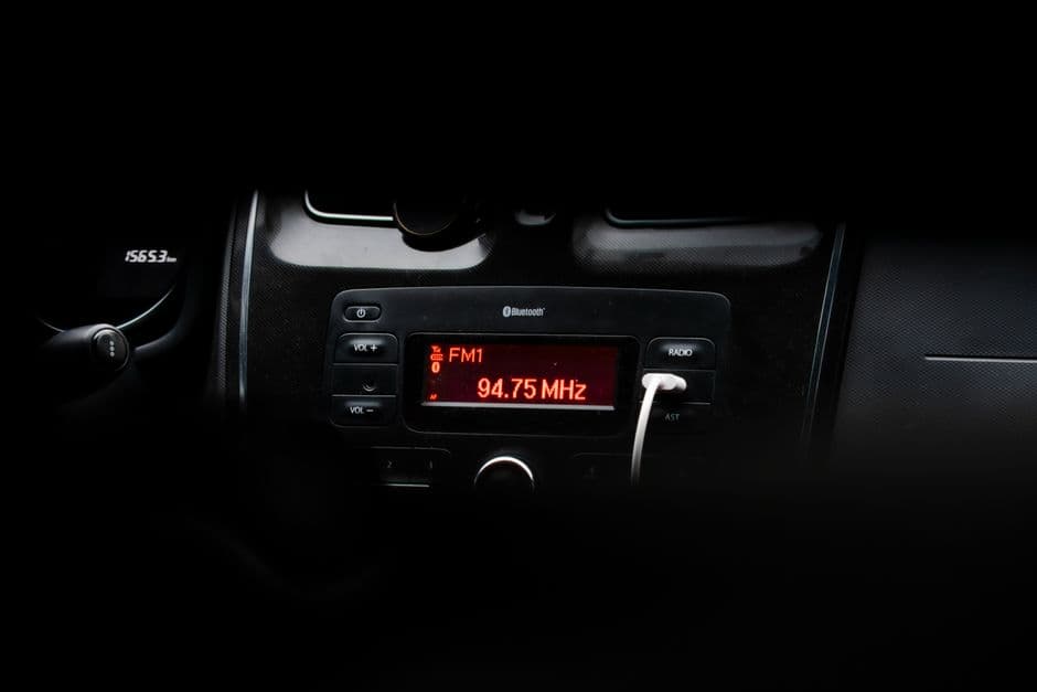 A car stereo head unit with a display and controls