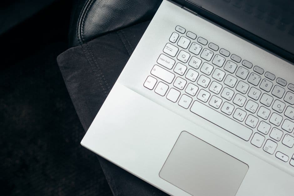 A laptop open on a car passenger seat