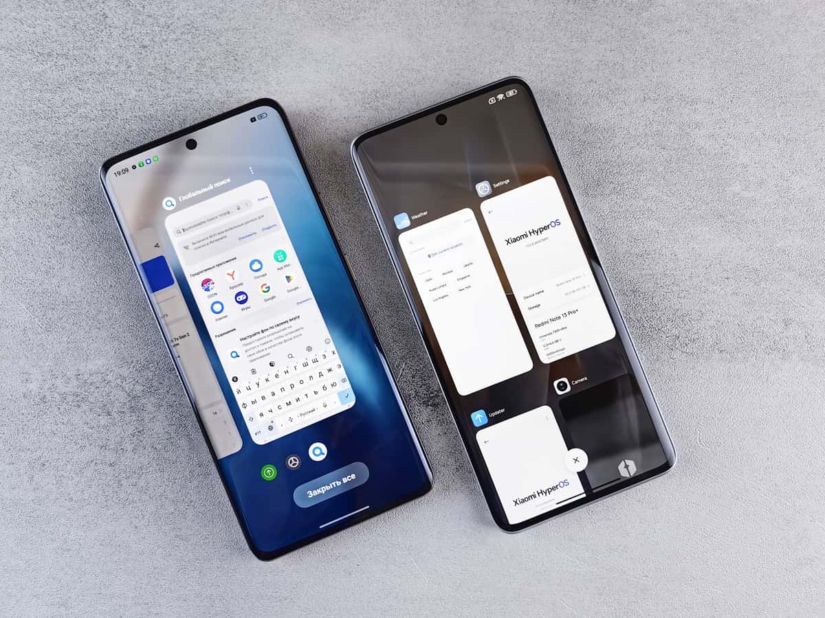 Two smartphones lying side by side on a table