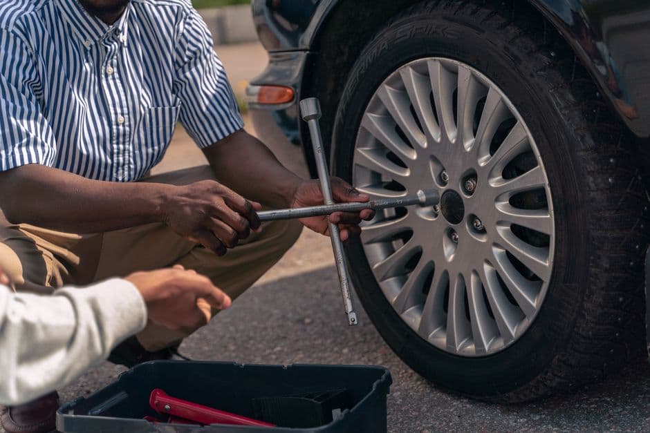 A car wheel and jack at the roadside