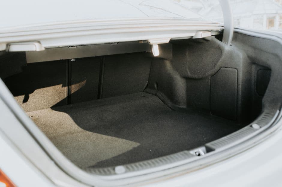 The empty cargo area of a hatchback with the seats up