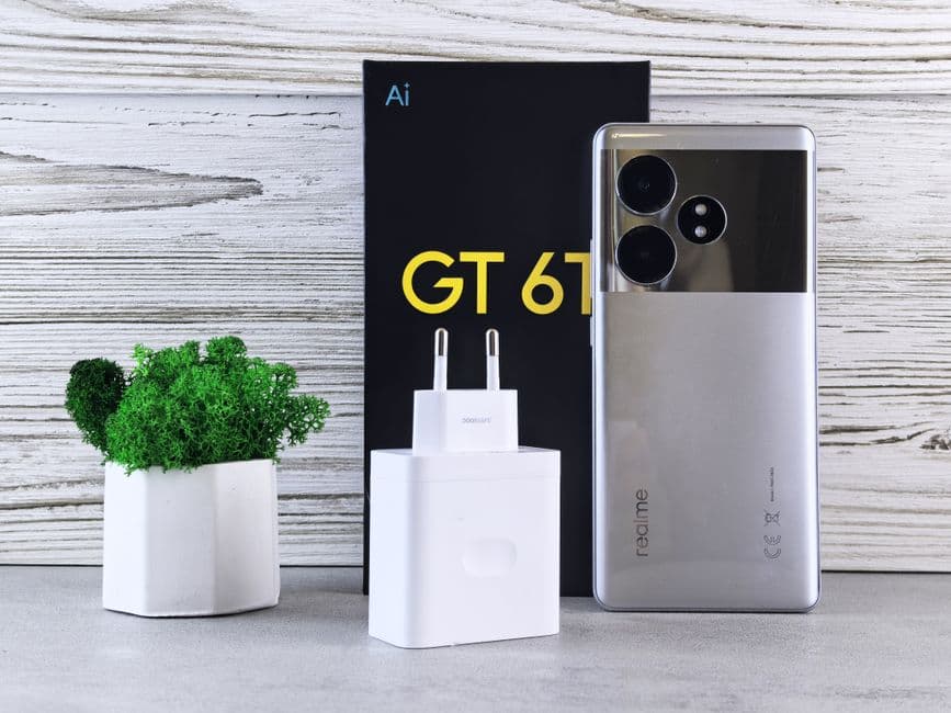 A phone charging wirelessly on a magnetic car mount