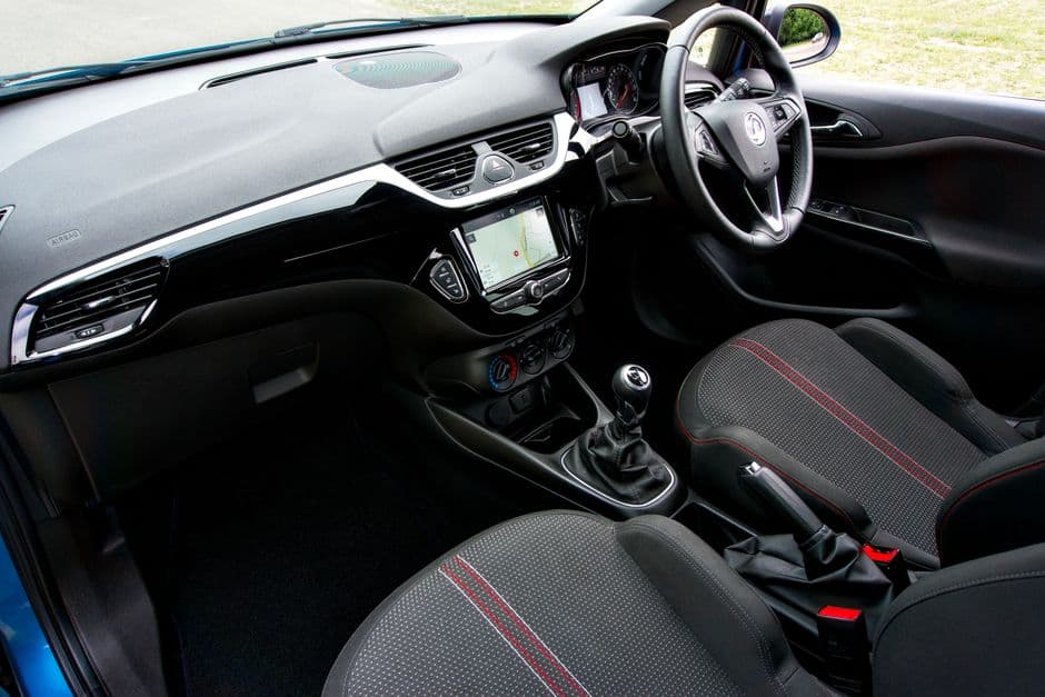 A molded rubber floor liner fitted in a car footwell